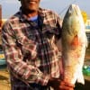 Maurice Prince of Pasadena TX nabbed onto this 27 inch slot red while fishing a finger mullet