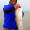 Tommy Mahen of Hamshire TX caught this 34 inch bull red but released it, stating that the fish was severly mauled by the flounder eating Dolphin and deserved to be released