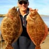 Former Marine Air Hollis Gassen of Kingwood TX nabbed these two nice flatfish on finger mullet