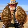 Gilchrist TX angler Capt Jack took these two nice flounder on Berkley Gulp