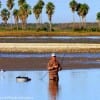 Lone bay wader casting for hopeful strikes