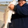 Surf angler Miquel Gaspar of Houston took this 24 inch slot red fishing a finger mullet in the surf