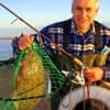 Victor Peprzala of Porter TX wade-fished Rollover Bay with Berkley Gulp for this nice 20 inch flounder