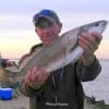 Patrick Coates of Koontze TX hefts this nice 5-11 lb gator-speck he took on soft plastic