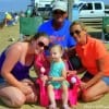 Mom, Nana, and Graps surround the young'un who's enjoying her very first fishing trip at Rollover