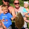 The Delk Family helps 5 yr old Jay show off his 19inch flounder