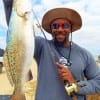 Clint Singleton of Houston lands his first speck of the morning on a live freelined shrimp