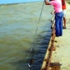 Rocky Martin netting Henri Fontenot's trout