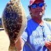 Stuart Yates of Rollover Pass hefts this nice flatfish caught on a finger mullet