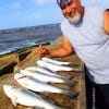 Lufkin TX angler- Hector Coria learned about night-fishing by catching these nice specks on finger mullet and popping corks