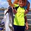 Charla Fagg helps Cameron Boillen of Beuamont TX with his nice stringer of gafftop he took on cut bait