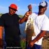 Dennis Dunham helps wife Karen with the whiting and drum catch she took on shrimp