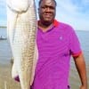 Fred Hubbard of Houston hefts this 41inch tagger bull red caught on shrimp