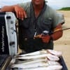 Houston Fire Fighter Gary Fruge' wade-fished Rollover bay with topwaters to catch this near limit of specks