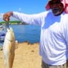 Ira Singleton of Houston hefts this 28inch slot red caught on finger mullet