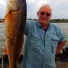 John Konior of Trinity TX wrastled this nice 27inch slot red in using shrimp for bait
