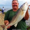 John Overton of Alvin TX fished with cut bunker shad to catch and tag this 32inch bull red