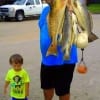 Mont Bellvieu angler Gary Fruge' with son hefting his specks and red catch of the day