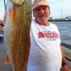 Sterling Tatro of Willis TX took this nice 27.5 inch slot red on crab