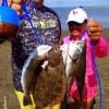 Bay waders Daniel Kiefer and Jeff Janecka of La Marque TX tethered up this stringer of trout and flounder while working Berkeley Gulp