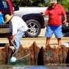Fellow angler nets a good flounder for his fishin buddy