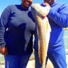 Linda Johnson has hubby Felton hold up her HUGE 35inch tagger bull red she caught on live shrimp