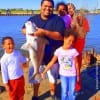 Nephews and Nieces surround Uncle Coyle of Houston who caught and released this HUGE 38inch drum he took on crab