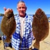 Sam Lanier of Fannett TX took these two nice flounder on finger mullet