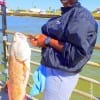 Vivian Dawson of Fulshear TX caught this 31inch tagger bull red on shrimp