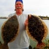 Butler PA angler Ray Kaskie hefts these two nice flounder caught on finger mullet