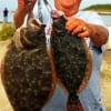 League City TX anglerette Poochie Walker shows off her 17 and 21 inch flounder she caught on Finger Mullet and Berkley Gulp