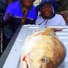 The Wild Bunch of Austin TX are amazed with their 42 inch tagger bull red that was caught on mullet