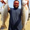 Alex Esmeralda of Houston took these two nice specks on live shrimp under popping corks