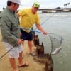 Father and son fishing team Brad and Klay Kirksey of Crosby TX team up where dad netted Klay's 4lb speck