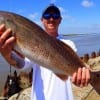 Jake Wesley Little of Round Rock TX displays his 28inch slot red he took on a finger mullet