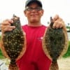 Crystal Beach angler Stacey Crews nabbed these twin flatfish on Gulp