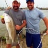 Fishin buds- Eric and Booger teamed up to land Booger's nice slot red he took on Berkley Gulp