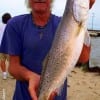 Jackie Bertolino of High Island TX lands another 26inch gator-speck while fishing a mirrOlure