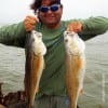 Mingo Garza of South Padre Island TX took these two nice slot reds while fishing finger mullet