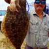 Nice 21.5inch doormat flounder for Joe Bryan after catching the Texas Halibut on a chartruce frog