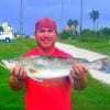 Rollover angler John Simpson fished soft plastics to catch this 8.8 lb gator-speck