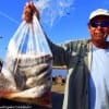 Stuart Yates of Briar Cliff TX bagged up a bunch of bull whiting he caught in the surf on shrimp