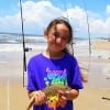 Eight yr old Andraya Karimalis of Huffman TX took this nice whiting while surf fishing with Grandpa Elroy- Andraya attends Copeland ISD