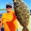 Rollover flatfish angler Poochie Walker took this fine doormat flounder on live shad