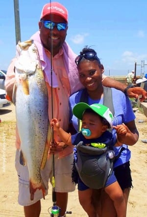 The Eric -Hook-Lip- Morrison Family from Houston shows off this really nice gator-speck caught on a Hogan-R