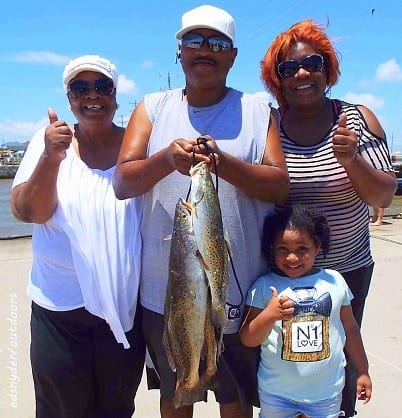 The Karl Ray Family of Houston teamed up to tether up this nice mess of trout on shad