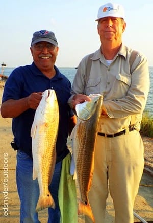 Fishin buds Isreal Ramos and CJ Smith of Liberty TX show off 2 of their four slot reds they caught on shrimp