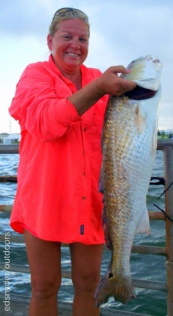 Lampasses TX Gal Leca Faulkner wrangled up this HUGE 35inch tagger bull red while fishing cut mullet