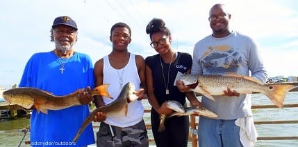 Houston anglers Joe and Jasmine Lewis with Frank Williams and Marcus Fleeman loade up with shrimp caught reds and trout to take home