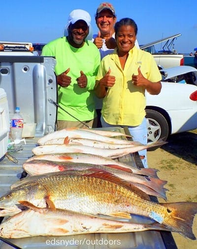 Night-Shift anglers Gill Villareal, with Roberta and Derrick Hayes fished Miss Nancy finger mullet on the 1 am hour to tailgate this mess o reds